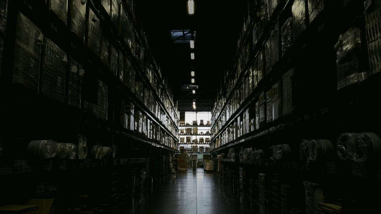 Aisle of tall racking in a distribution warehouse